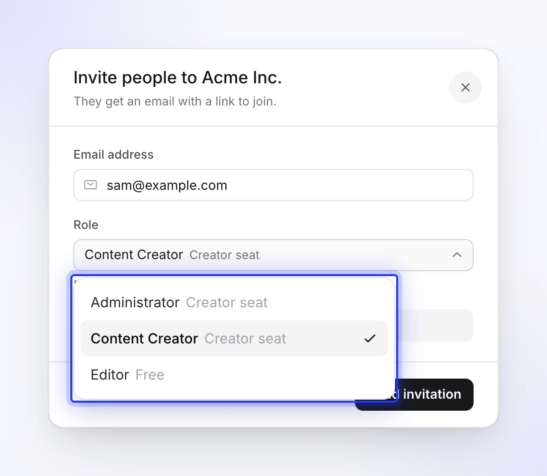 The invite dialog with the Role menu showing which roles use a creator seat